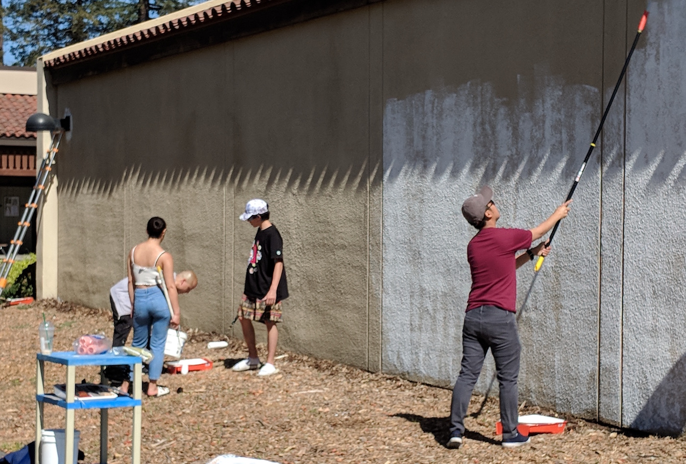 students preparing wall