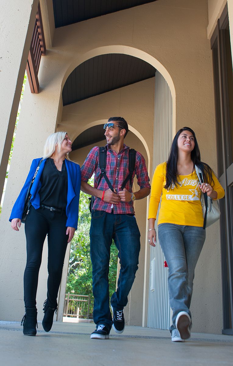 Students walking under arch