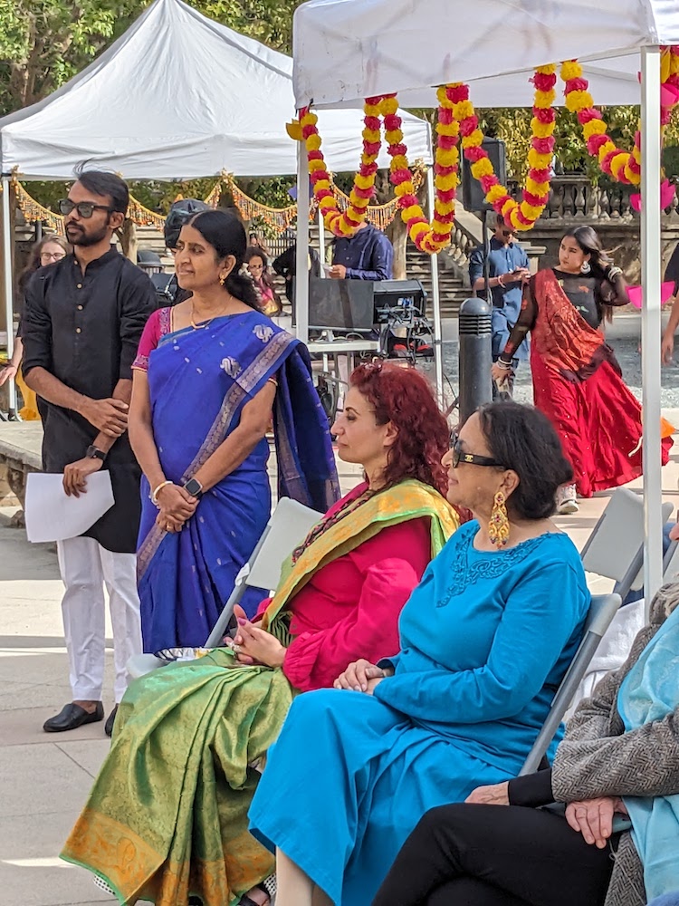 dean and former chancellor seated in colorful gowns