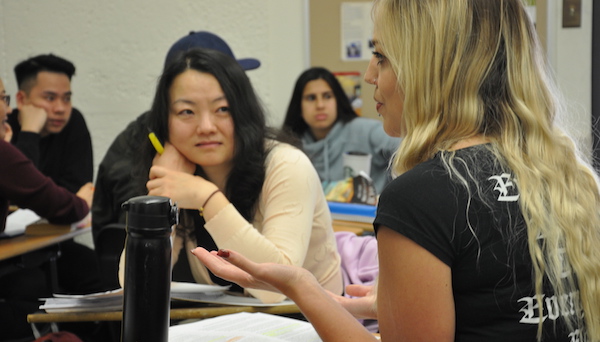 students talking in class