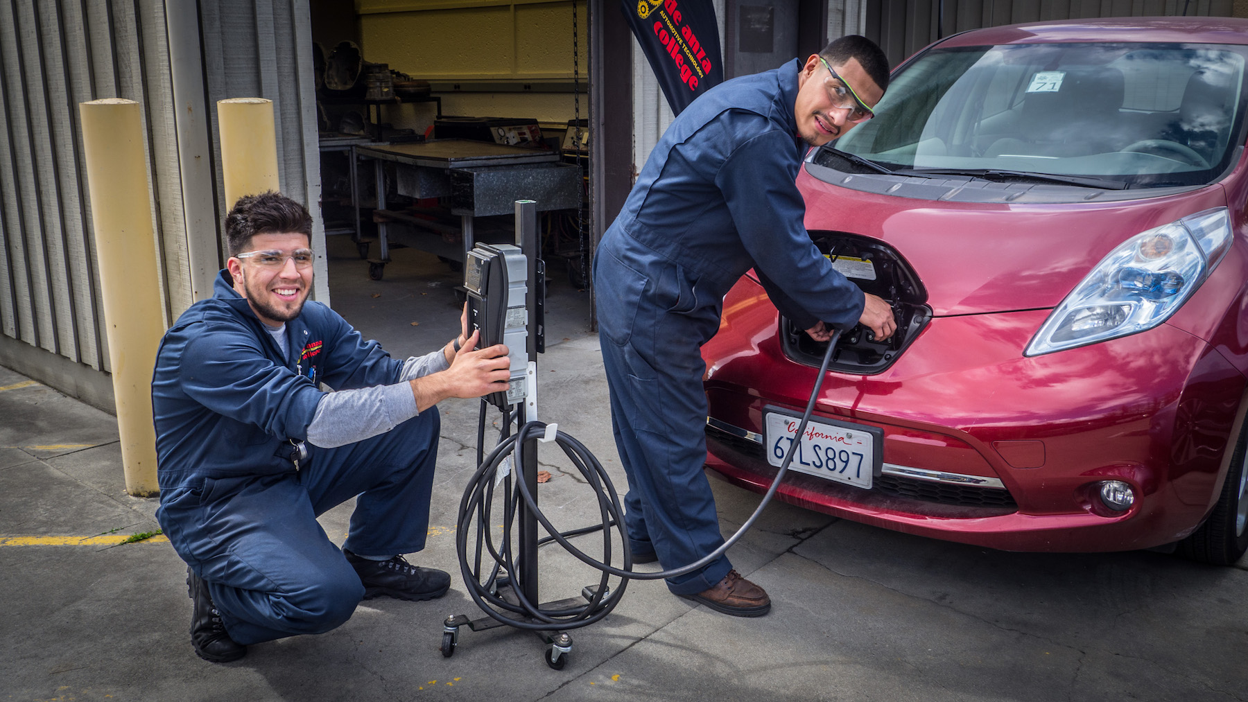 two students with electric car