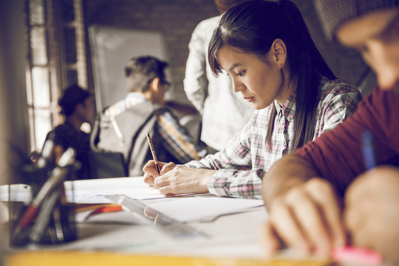 young woman at worktable