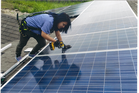 student working on solar panel