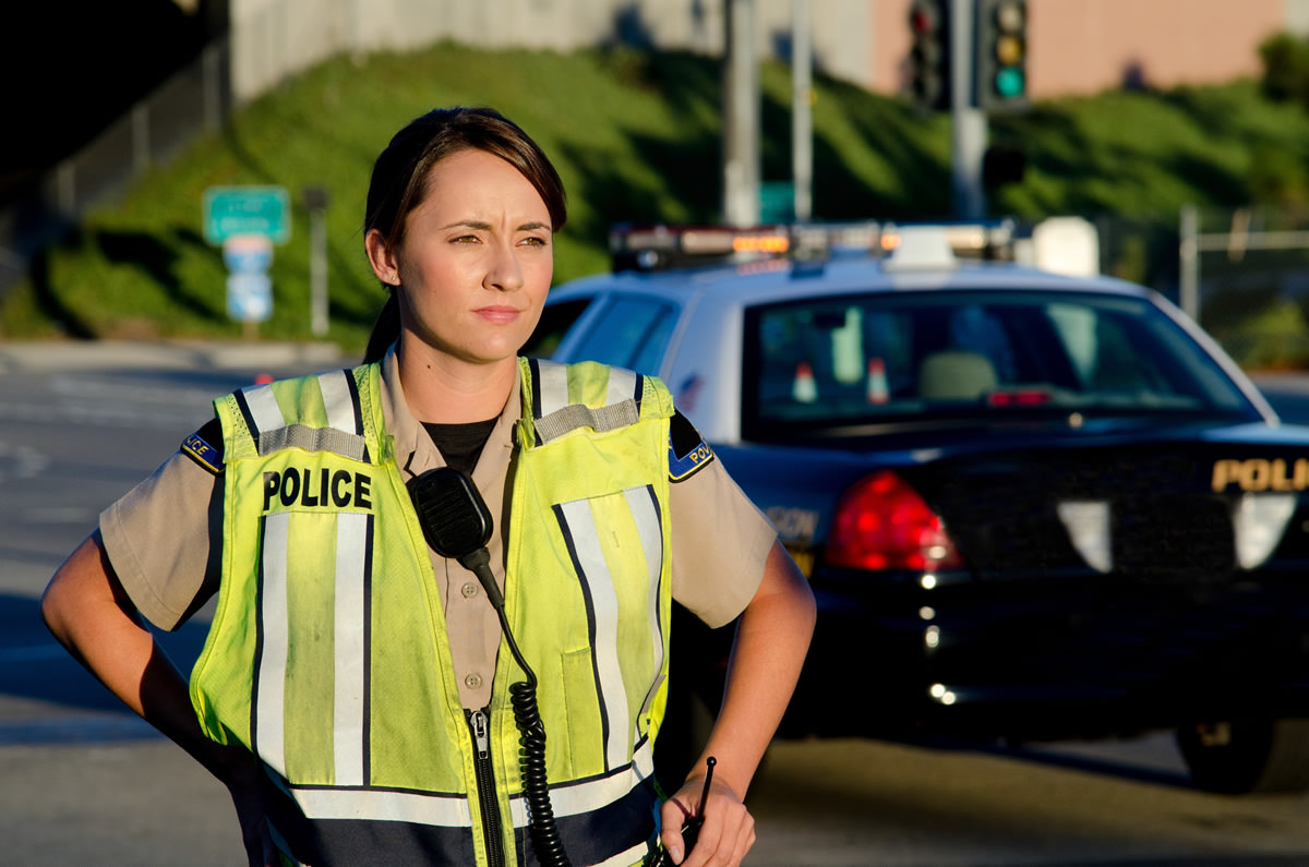 young woman in police uniform