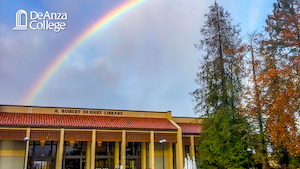 View of a rainbow above the De Anza College library