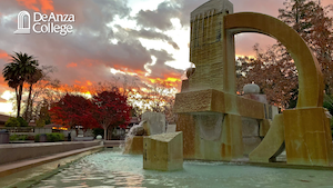 View of a sunrise behind the Sunken Garden fountain