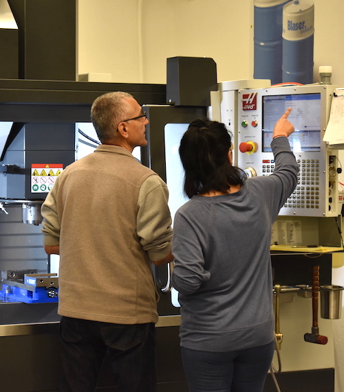 instructor and student at Haas machine