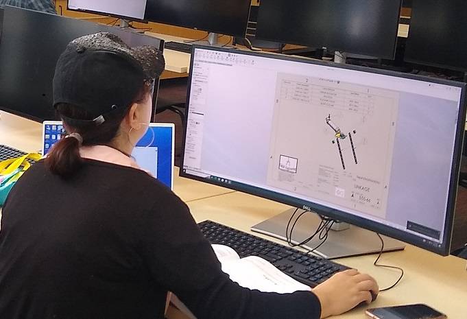 DMT Student Working on  CAD Design in Lab