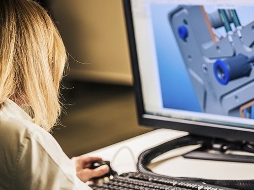 woman at computer doing design work