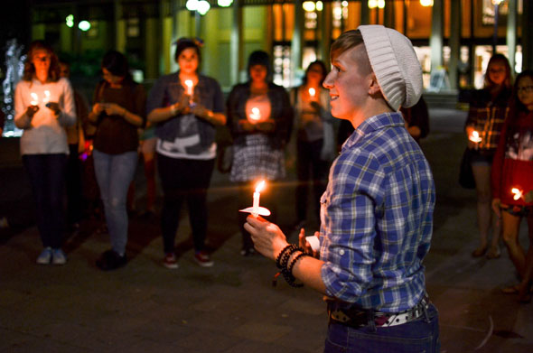 Female student holding candle