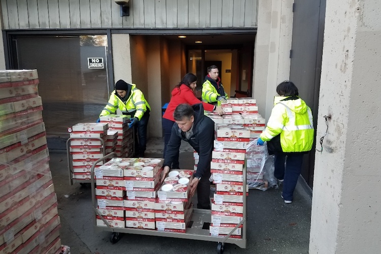 volunteers unloading food