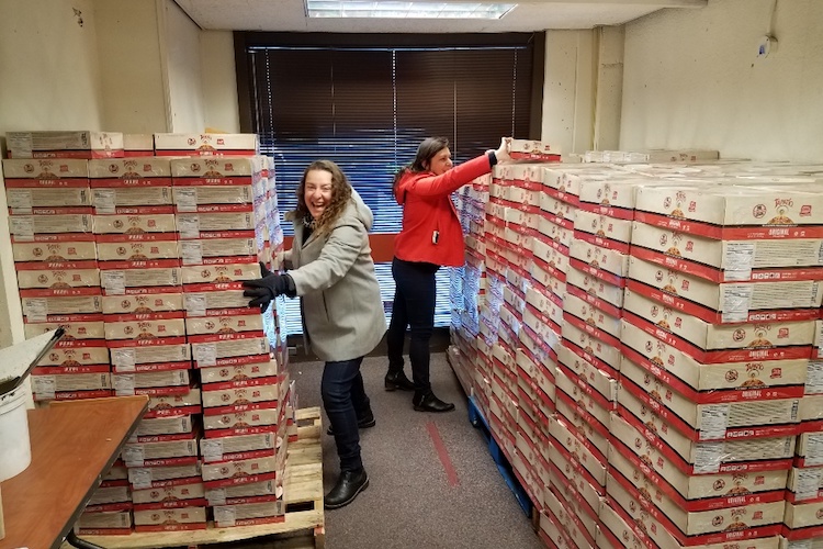 volunteers stacking food