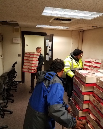 Volunteers stacking ramen bowls