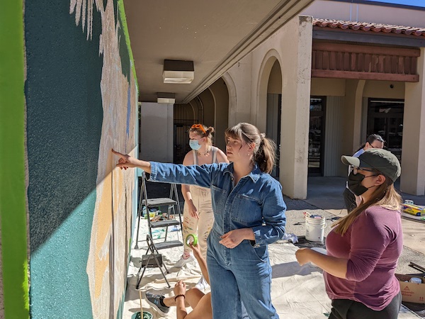 students working on mural