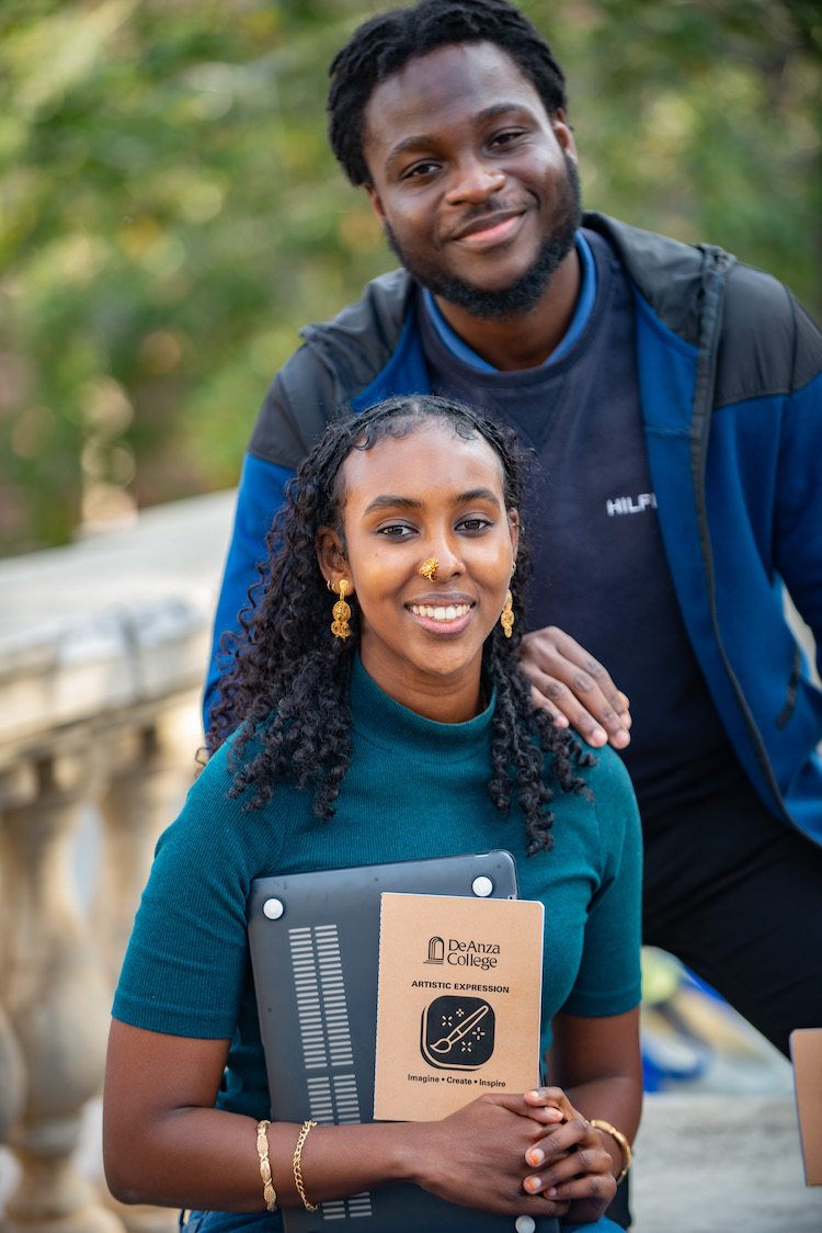 young man and young woman with De Anza notebook