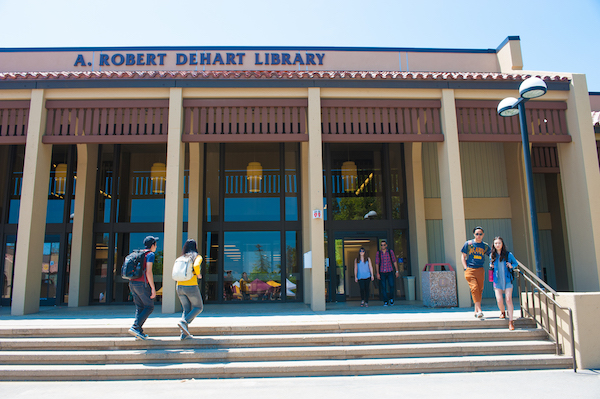 students walking in and out of Library