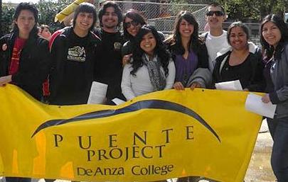 Students holding Puente banner