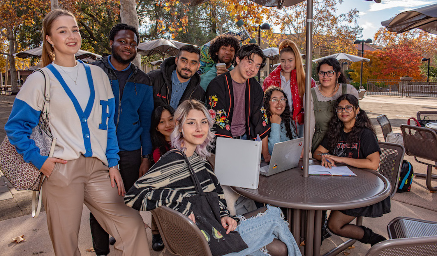 group of students at table outside