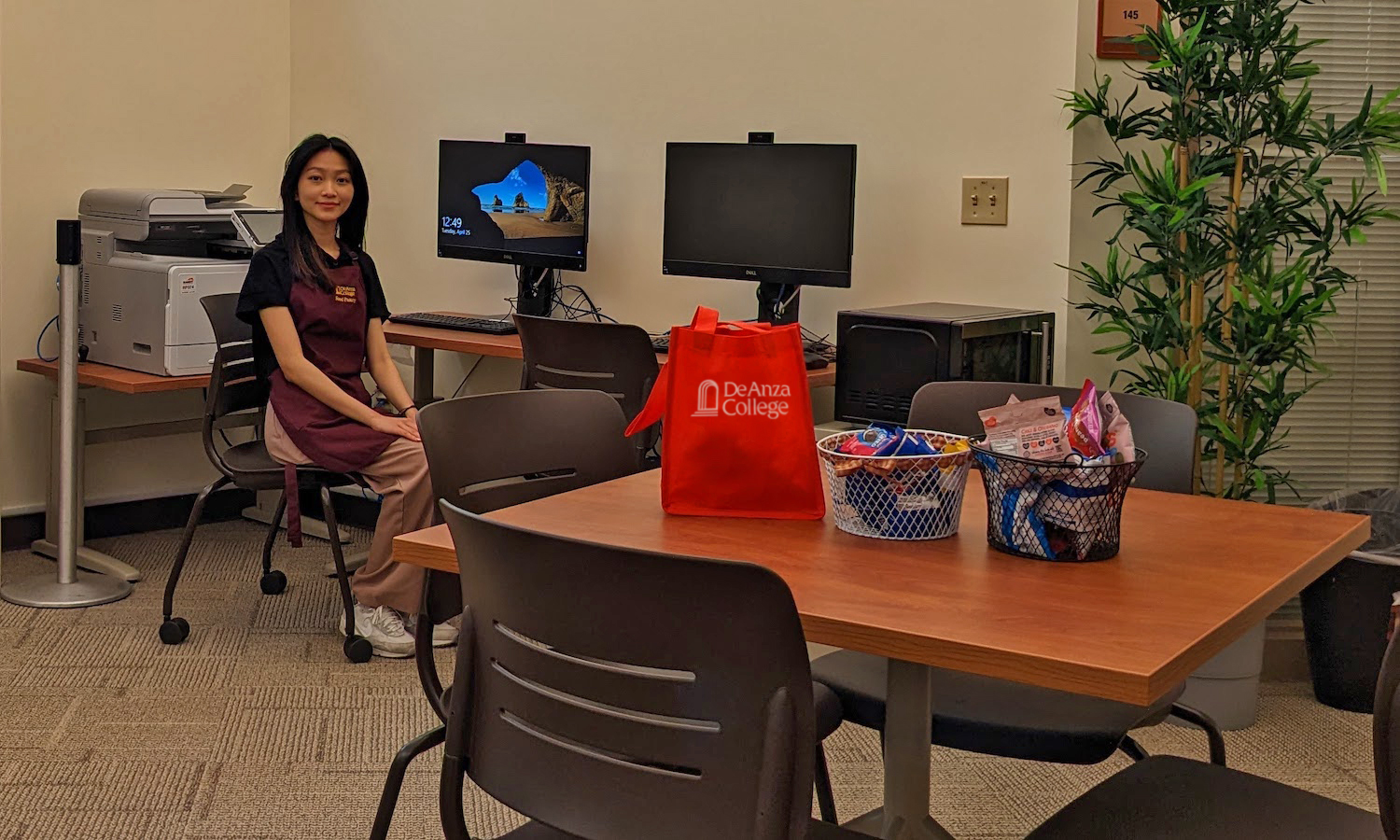 student worker at computer table