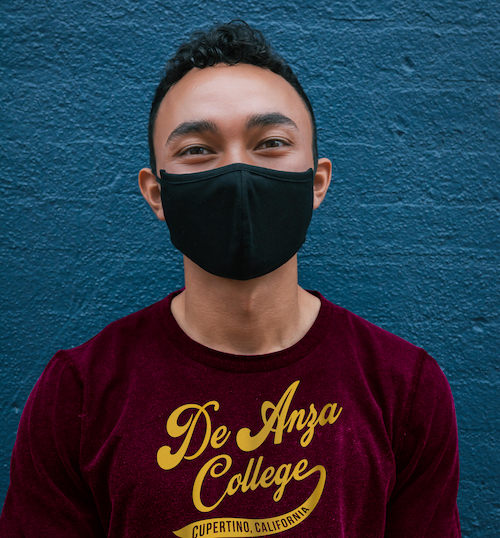 young man in De Anza shirt with face mask
