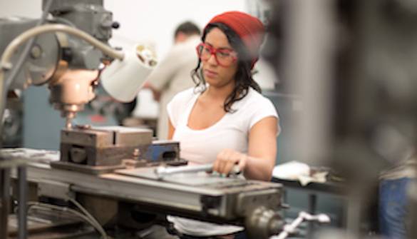 Woman operating machinery