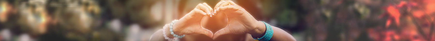 students making heart with fingers